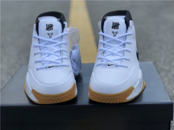 Undefeated Zoom Kobe 1 Protro White brand logo on tongue