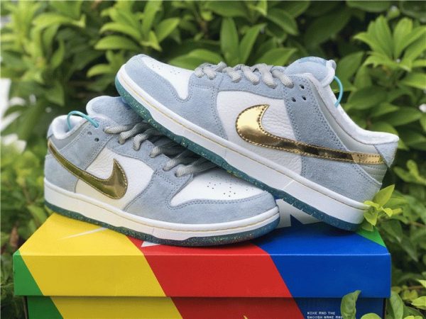 Sean Cliver x Nike Dunk Low SB gold swoosh