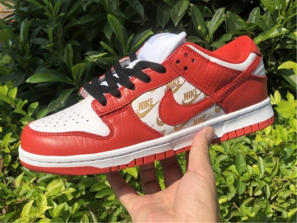 Supreme x Nike SB Dunk Low Red White on hand