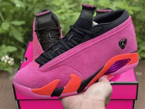 Shocking Pink Jordan 14 Retro Low on hand